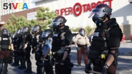 Minnesota State Police protect a Target Store, May 28, 2020, in St. Paul, Minn. 