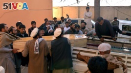 Afghan men carry the coffin of a victim of a deadly suicide attack in Kunar province, east of Kabul, Afghanistan, Saturday, Feb. 27, 2016. At least 10 civilians were killed Saturday morning when a suicide bomber on a motorcycle targeted on a local tribal leader near a park, an Afghan official said. The tribal leader Khan Jan was among those killed. (AP Photos/Mohammad Anwar Danishyar)