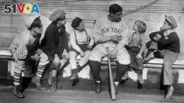In his heyday, Babe Ruth was one of the highest paid athletes and most famous people in the world. Here, he tells children stories of his life from orphanage to baseball fame, November 29, 1924. (AP File Photo)