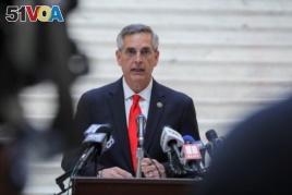 FILE - Georgia Secretary of State Brad Raffensperger gives an update on the state of the election and ballot count during a news conference at the State Capitol in Atlanta, Georgia, Nov. 6, 2020.