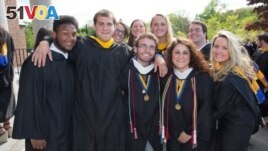 FILE -- Friends pose together at their graduation from Merrimack College in North Andover, Massachusetts. (Photo by Flickr user Merrimack College via Creative Commons license.)
