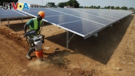A Ugandan worker builds a solar plant in Soroti about 300 kilometers east of Uganda capital Kampala. 
