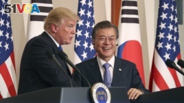 President Donald Trump, left, speaks as South Korean President Moon Jae-in looks on during a joint news conference at the Blue House in Seoul, South Korea, Tuesday, Nov. 7, 2017.