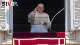 Pope Francis delivers his blessing as he recites the Angelus noon prayer from the window of his studio overlooking St.Peter's Square, at the Vatican, Sunday, July 17, 2022. (AP Photo/Andrew Medichini)
