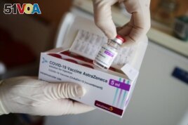 FILE - In this March 3, 2021 file photo ,a package of the AstraZeneca COVID-19 vaccine is shown in the state of Brandenburg where the first coronavirus vaccinations are given in doctors' surgeries, in Senftenberg, Germany.
