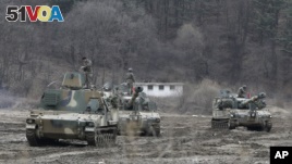 South Korean army soldiers on motorized artillery take part in this year's joint military exercises in Paiu near the border with North Korea. Tensions are especially high this year because of North Korea's response to U.N. Security Council sanctions put in place because of the North's nuclear and missile tests.