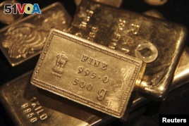 FILE - Gold prices have risen because of interest rates around the world.