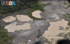 Aerial view over an area deforested by illegal gold mining in the Madre de Dios province of Peru, Tuesday, Feb. 19, 2019