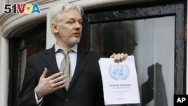 WikiLeaks founder Julian Assange speaks on the balcony of the Ecuadorean Embassy in London, Friday, Feb. 5, 2016. A U.N. human rights panel says Assange has been 