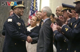 Eddie Johnson (left) and Rahm Emanuel at Johnson's swearing in as police superintendent.