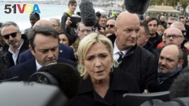 Far right leader and presidential candidate Marine Le Pen arrives to pay homage to the 86 victims of an attack last year, Monday Feb. 13, 2017 in Nice, southern France. (AP Photo/Christian Alminana)<I>&#</I>13;<I>&#</I>10;