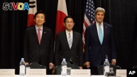 Minister of Foreign Affairs Yun Byung-se of South Korea, left, Minister of Foreign Affairs Fumio Kishida of Japan, and U.S. Secretary of State John Kerry stand for a photo during a meeting between the three leaders Sunday, Sept. 18, 2016, in New York . 