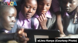 Children in Kenya using eLimu tablet to access educational software.