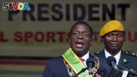 Zimbabwe's President Emmerson Mnangagwa speaks after being sworn in at the presidential inauguration ceremony in the capital Harare, Zimbabwe, Nov. 24, 2017.
