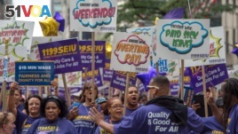 FILE - Members of 1199 Service Employees International Union march up Fifth Avenue in the annual Labor Day Parade in New York in 2015. (AP Photo/Bryan R. Smith)