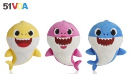 This picture shows the WowWee pinkfong Baby Shark family of singing plush toys. The viral song and its kiddie music videos have entranced toddlers and parents alike, though some of the grown-ups are now suffering from shark fatigue. (AP Photo/WowWee)