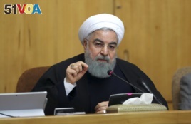 In this photo released by official website of the office of the Iranian Presidency, President Hassan Rouhani speaks in a cabinet meeting in Tehran. Dec. 31, 2017. After a wave of economic protests swept major cities in Iran, President Rouhnai said that pe