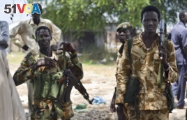 Sudanese government soldiers patrol in South Sudan. South Sudan's army has burned people alive, raped and shot girls, according to UN officials.