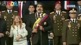 Venezuelan President Nicolas Maduro reacts during an event that was interrupted, reportedly by explosives from drones, in this still frame taken from government video, Aug. 4, 2018, in Caracas, Venezuela. VENEZUELAN GOVERNMENT TV/Handout via REUTERS TV