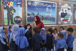 Hameeda Danesh meets with children during her parliamentary campaign.