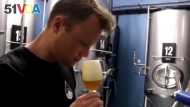 Thomas Gesink of Brewery de Prael in Amsterdam tastes beer made from rainwater.