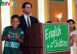 Jose Antonio Gonzalez, 10, left, cheers with other children as Proposition 227 writer Ron Unz addresses the media and supporters of the proposal to end bilingual education in the state, in Los Angeles Tuesday, June 2, 1998.