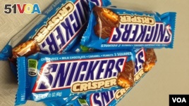 A display of chewy crisp rice, milk chocolate, caramel and peanut Snickers bars. Confectionery maker Mars has issued a recall of its candy bars across Europe over fears that plastic pieces could be found inside. The recall covers 55 countries.