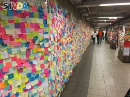 Anti-Trump Stickies posted Thursday at New York City rail station.
