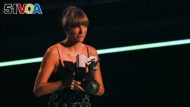 FILE - Taylor Swift receives the award for the Best Longform Video during the 2022 MTV Europe Music Awards (EMAs) at the PSD Bank Dome in Duesseldorf, Germany, November 13, 2022. (REUTERS/Wolfgang Rattay)