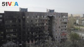 A view shows a residential building damaged during Ukraine-Russia conflict in the southern port city of Mariupol, Ukraine April 19, 2022. Picture taken with a drone. (REUTERS/Pavel Klimov)