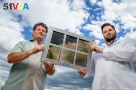 John Conklin (left) and Scott Hammond of SolarWindow Technologies Inc. with their transparent solar cell