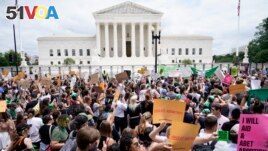 Protesters gather outside the Supreme Court in Washington, Friday, June 24, 2022. The Supreme Court has ended constitutional protections for abortion that had been in place nearly 50 years. (AP Photo/Jacquelyn Martin)