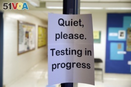 In this photo taken Jan. 17, 2016, a sign is seen at the entrance to a hall for a college test preparation class at Holton Arms School.