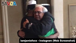 Jamie Foxx hugs the father of Brett Kyle.