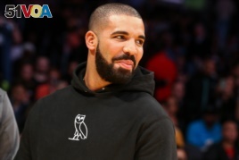FILE - Drake attends an NBA game.