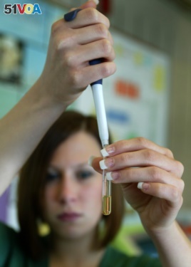 Brielle Hicks prepares to test the biodiesel fuel in a laboratory at Sinclair Community College in Dayton, Ohio.