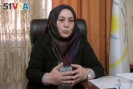 Semira Haj Ali, a senior Kurdish education official, speaks during an interview with Reuters at her office in Qamishli, Syria, March 11, 2019. Picture taken March 11, 2019. REUTERS/Issam Abdallah