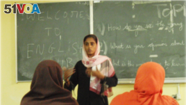 A student presenting to their English Club.