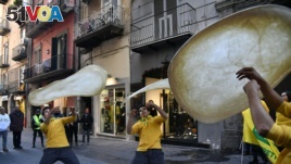 Members of the Pizzaioli Acrobats Coldiretti perform 