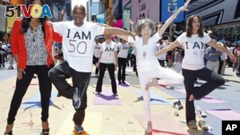 Tao Porchon-Lynch teaches yoga to hundreds in Times Square, NYC in 2013. At the time this photo was taken she was 94 years young. (Brian Ach/AP Images)