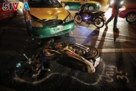 FILE - The positions of colliding vehicles are marked at the site of a road accident during the Songkran festival in Bangkok, Thailand.
