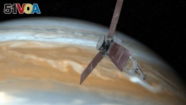 This undated image shows shows an artist's rendering of NASA's Juno spacecraft making a close pass over Jupiter. (NASA via AP)