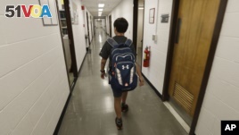 Jeremy Shuler, 12, a freshman at Cornell University, walks to meet an adviser on campus in Ithaca, New York, Aug. 26, 2016. He's the youngest student on record to attend the Ivy League school. 
