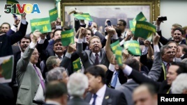 Members of the impeachment committee react after voting on the impeachment of Brazilian President Dilma Rousseff at the National Congress in Brasilia, Brazil April 11, 2016.