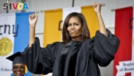 Former first lady Michelle Obama reacts to cheers from the class of 2016, during commencement for City College of New York on Friday June 3, 2016.