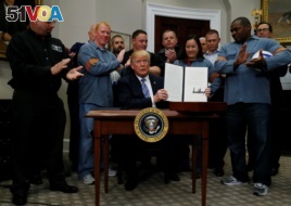 U.S. President Donald Trump is after signing a proclamation to establish tariffs on imports of steel and aluminum at the White House in Washington, March 8, 2018.