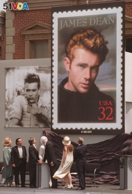 Postal and film industry officials view the unveiling of the new James Dean stamp at a ceremony, June 24, 1996 on the lot where Dean filmed 
