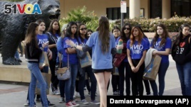  A bioengineering student leads prospective college-bound high school seniors on a campus tour in Los Angeles. Fewer California high school students have been offered admission to University of California campuses for the fall, officials reported