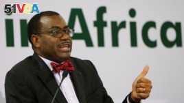 FILE - African Development Bank (AfDB) President Akinwumi Adesina gestures as he addresses a news conference at the annual meeting of AfDB in Gandhinagar, India, May 22, 2017.