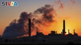 FILE - Dave Johnson coal-fired power plant near Glenrock, Wyoming. CO2 emissions from the world's electric power industry fell two percent in 2019.